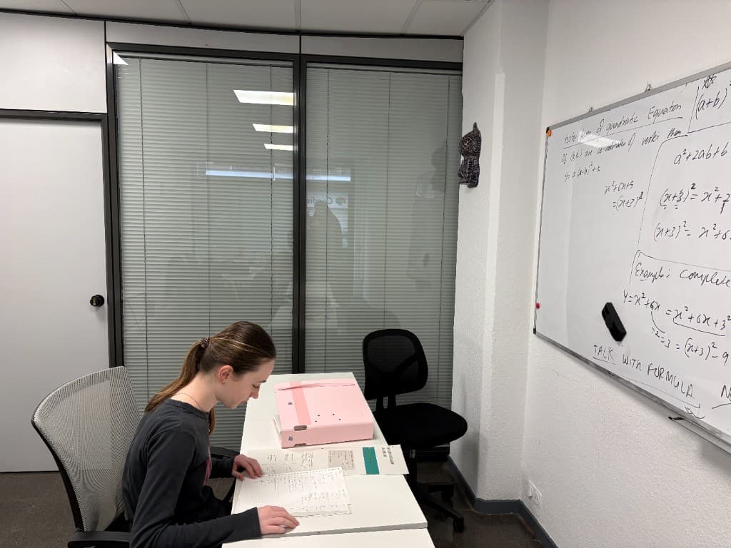 Student reviewing solved math steps during one-to-one support.