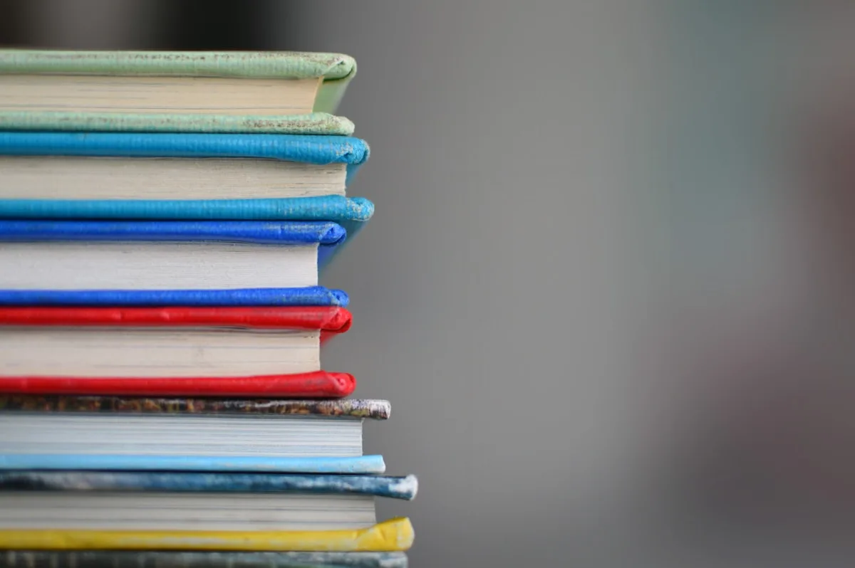 Stack of study books and reference materials